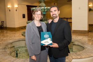 CEO Lore Pease and Chief Quality Officer and Medical Director Matthew Probst with their Employer of Excellence award at AAPA 2018