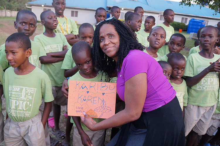 Karen Roane, alongside children, while volunteering in Kenya